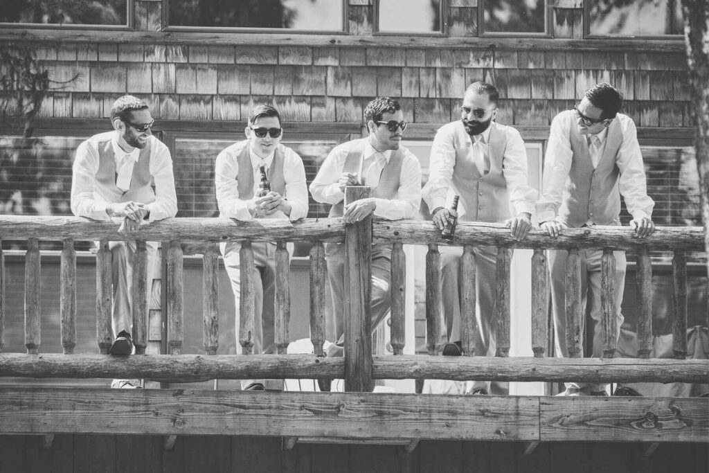 Groomsmen posing for a photo at one of the cabins