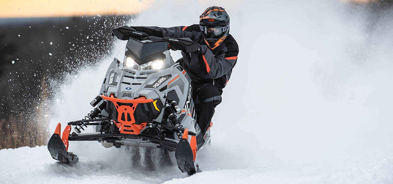 guest riding on a snowmobile